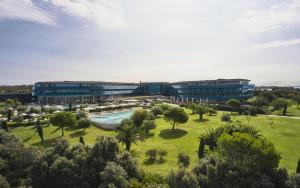 an aerial view of a building with a pool and trees at Falkensteiner Hotel & Spa Iadera in Zadar