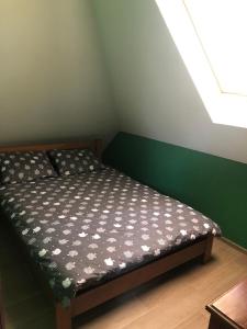 Una cama o camas en una habitación de Хуторок В'юн