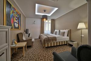 Postel nebo postele na pokoji v ubytování Hotel Pod Bránou