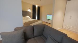TV a/nebo společenská místnost v ubytování Granda Hotel