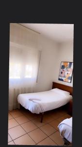Postel nebo postele na pokoji v ubytování Hostal San Andrés