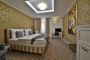 Postel nebo postele na pokoji v ubytování Hotel Pod Bránou