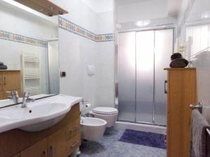 a bathroom with a sink and a toilet and a shower at Fronte Mare in Molfetta +20 photos