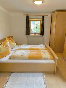 A bed or beds in a room at Waldruhe Appartements