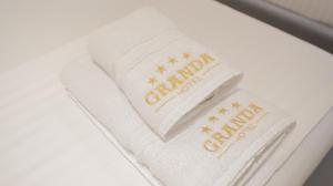Certifikát, hodnocení, plakát nebo jiný dokument vystavený v ubytování Granda Hotel