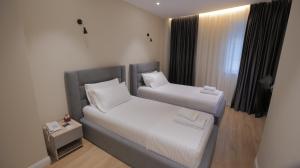 Postel nebo postele na pokoji v ubytování Granda Hotel