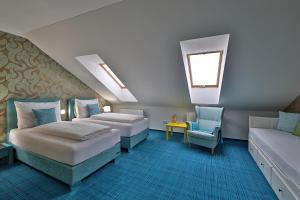Postel nebo postele na pokoji v ubytování Hotel Pod Bránou