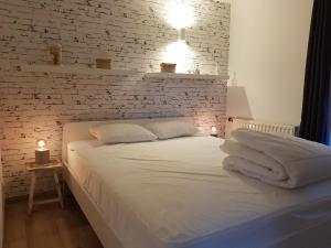 En eller flere senge i et værelse på Gite rural '21 bonnes raisons' - Ossogne