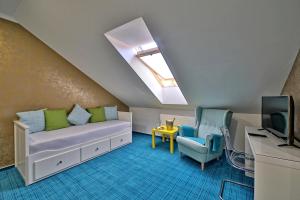 TV a/nebo společenská místnost v ubytování Hotel Pod Bránou