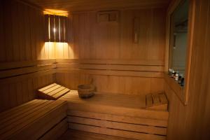a sauna with a bench in a wooden room at Spa Resort Luxury Apartments in Budva