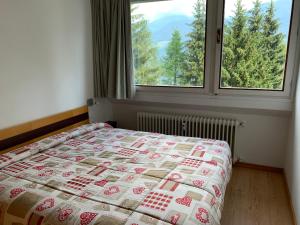 Postel nebo postele na pokoji v ubytování Residence Copai