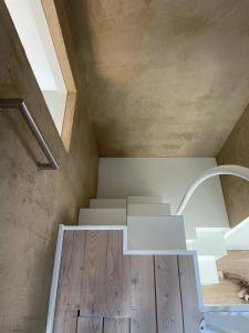 a staircase in a house with wooden floors at Loft Sternenblick in Lüdinghausen