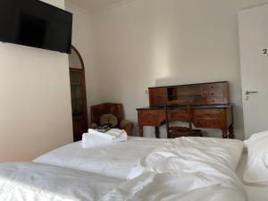 Postel nebo postele na pokoji v ubytování B&B The White House