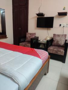 เตียงในห้องที่ Hotel Aarjee Crescent Jaipur