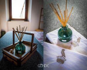un jarrón verde con palos de bambú en una caja en Appartamento Bellavista, en Celleno