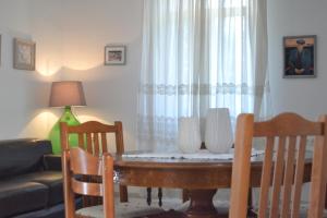 a living room with a table and chairs and a window at Tsartsada house in Áno Lefkímmi
