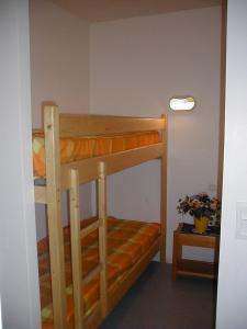 a couple of bunk beds in a room at Le Chalet du Ticou in Bolquere Pyrenees 2000