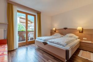 Posteľ alebo postele v izbe v ubytovaní Wiesengrund - Wohnung 5