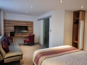 Postel nebo postele na pokoji v ubytování Escape Hotel
