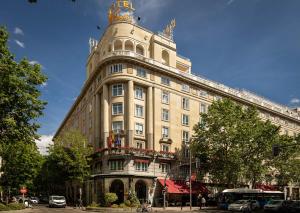 a large building with a tower on top of it at Wellington Hotel & Spa Madrid in Madrid