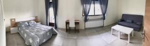 Posteľ alebo postele v izbe v ubytovaní La Villa Hostal