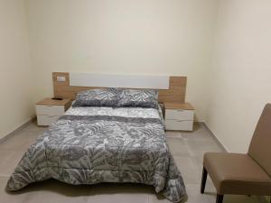 Posteľ alebo postele v izbe v ubytovaní La Villa Hostal