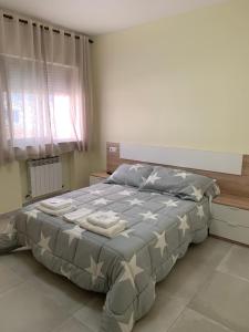 Posteľ alebo postele v izbe v ubytovaní La Villa Hostal