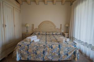 A bed or beds in a room at Il Giardino degli Oleandri