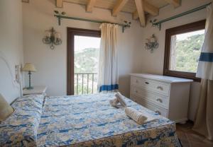 A bed or beds in a room at Il Giardino degli Oleandri