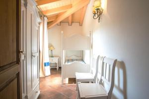 A bed or beds in a room at Il Giardino degli Oleandri