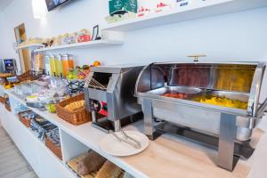 a kitchen with a counter with a food truck at Hotel Gabbiano in Rimini