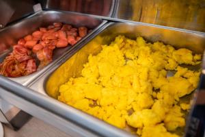 a tray of food with different types of food at Hotel Gabbiano in Rimini
