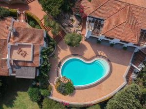 The swimming pool at or close to Il Giardino degli Oleandri