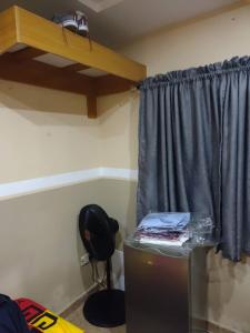 a room with a window and a desk with a desk at The Edgewood Manor, Entire Service apartment with 24 hours power in Akure