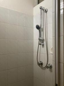a shower with a shower head in a bathroom at Hotel Villa Sorci in Rimini
