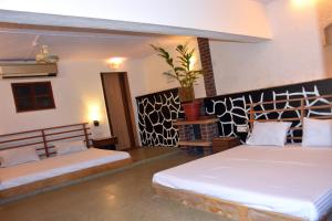 Voodi või voodid majutusasutuse Quentella Villa 3Bhk Igatpuri toas