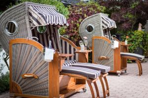 a group of chairs sitting on a patio at Hotel Zentral ****superior in Kirchberg in Tirol