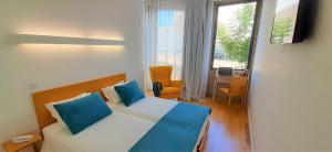 Cama o camas de una habitación en Boavista Class Inn