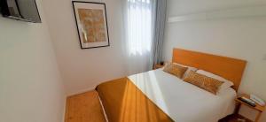 Cama o camas de una habitación en Boavista Class Inn