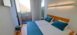 Cama o camas de una habitación en Boavista Class Inn