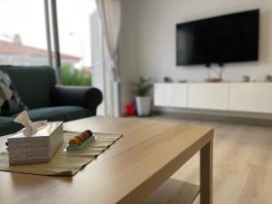 a living room with a table with a box on it at Villa Erna Relax Dream Holiday in Callao Salvaje