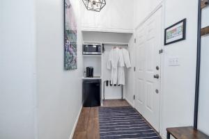 
a room with a white wall and a white floor at Red Rock Inn Cottages in Springdale
