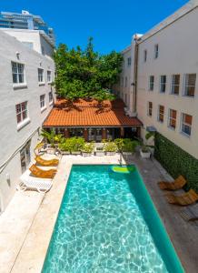 a swimming pool in the middle of a building at Cento Collins Stays by Mercury South Beach in Miami Beach
