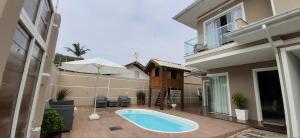 Hồ bơi trong/gần Casa de Praia em PONTA DAS CANAS, FLORIANÓPOLIS