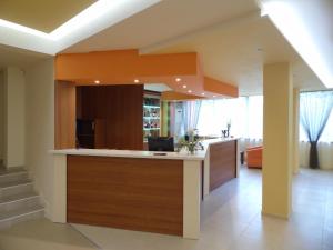 a kitchen with an island in the middle of a room at Park Hotel Kamchia in Kamchia