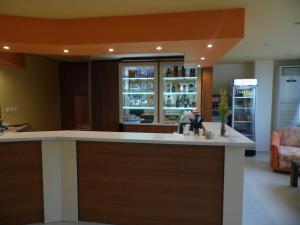 a kitchen with a bar with a sink in it at Park Hotel Kamchia in Kamchia +23 photos