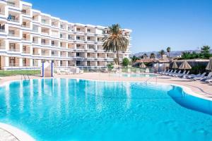 a large swimming pool in front of a hotel at Tamaran 106 Vv Maspalomas in Playa del Ingles