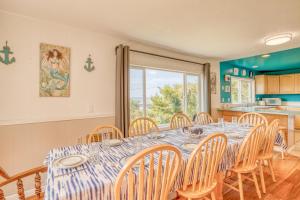 a dining room with a table and chairs at Sea Haven in Lincoln City