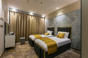 Postel nebo postele na pokoji v ubytování Lambert ApartHotel