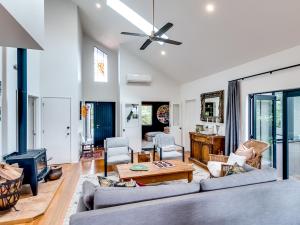 a living room with a couch and a table at Havelock Haven - Havelock North Holiday Home in Havelock North